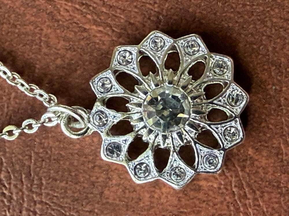 1928 Jewelry Silver Tone Crystal Sunburst Flower Pendant Necklace